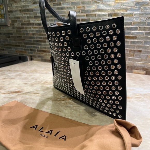 ALAÏA Mina Small perforated leather tote bag - Picture 11 of 14